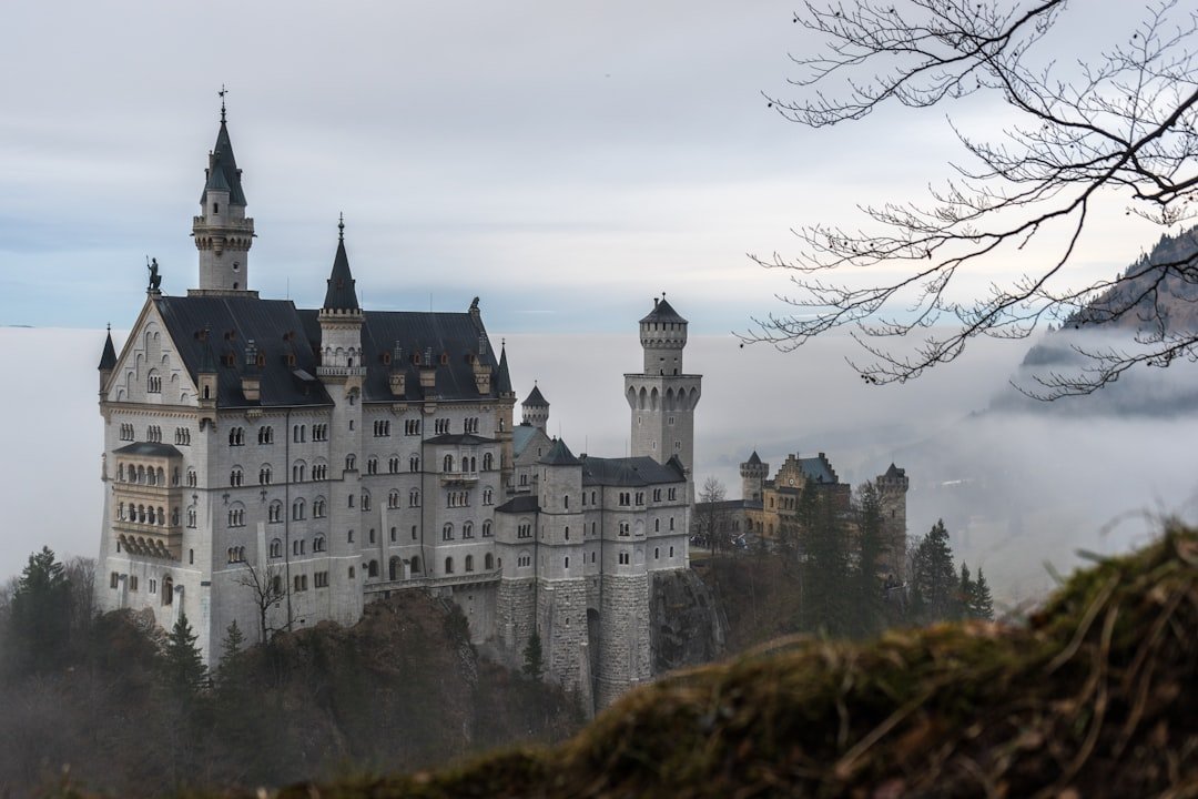 Fairy tale castle above alpine lake