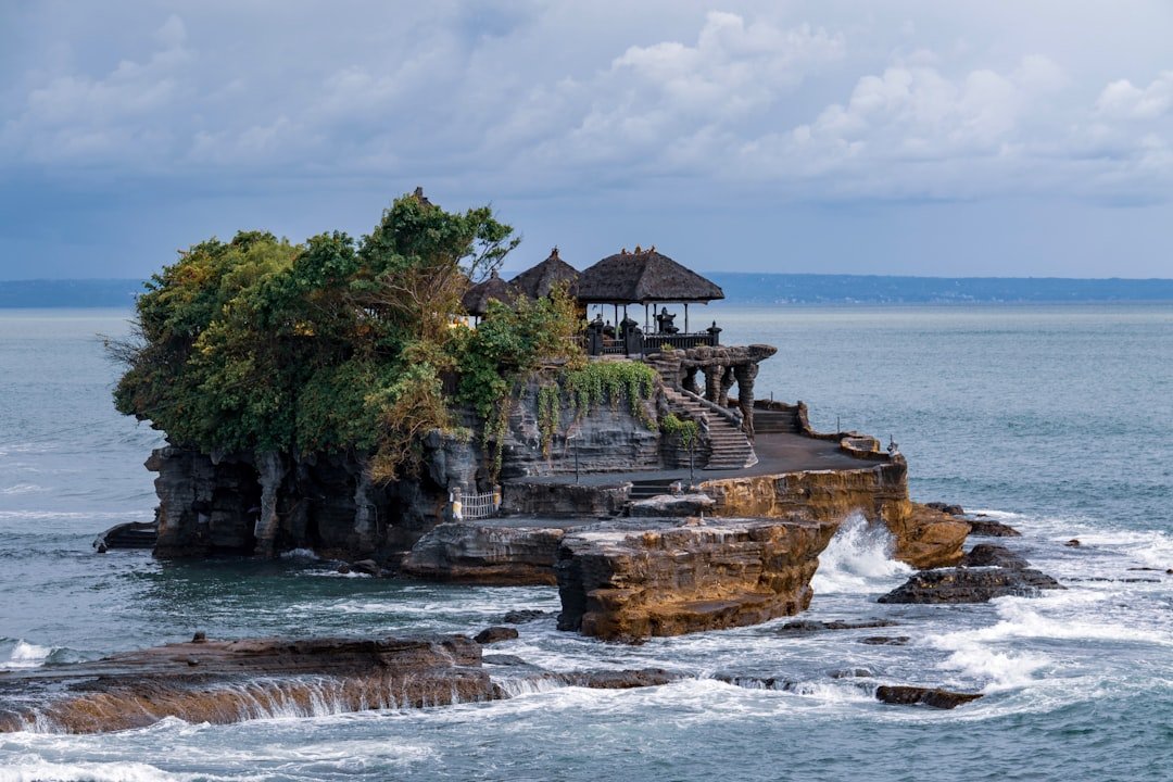 Tanah Lot temple silhouetted on sea rock