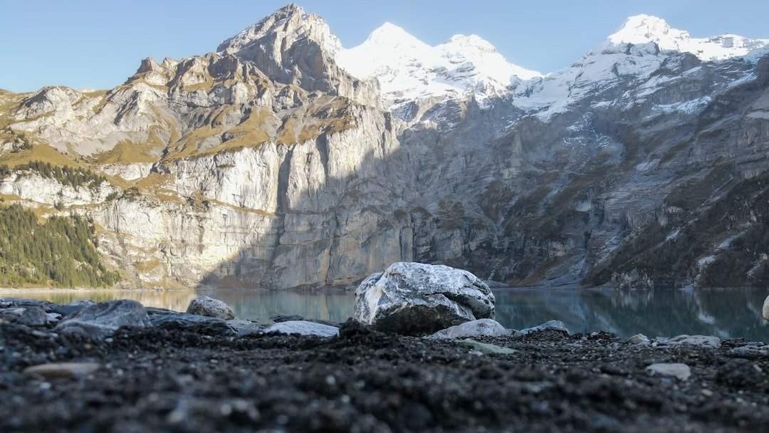 High alpine turquoise lake with cliffs