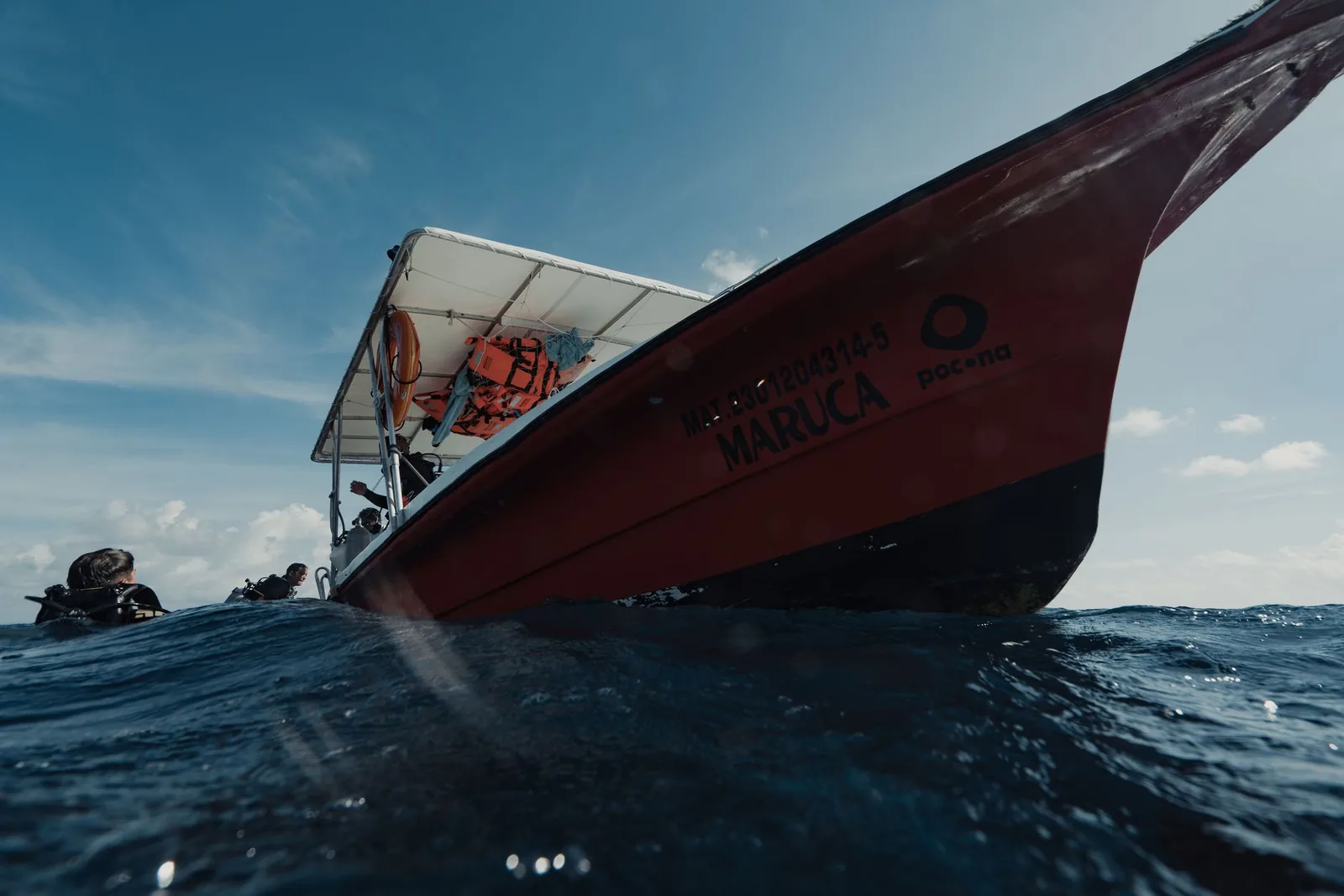 Experience a thrilling boat ride and diving adventure near Isla Mujeres, Mexico.