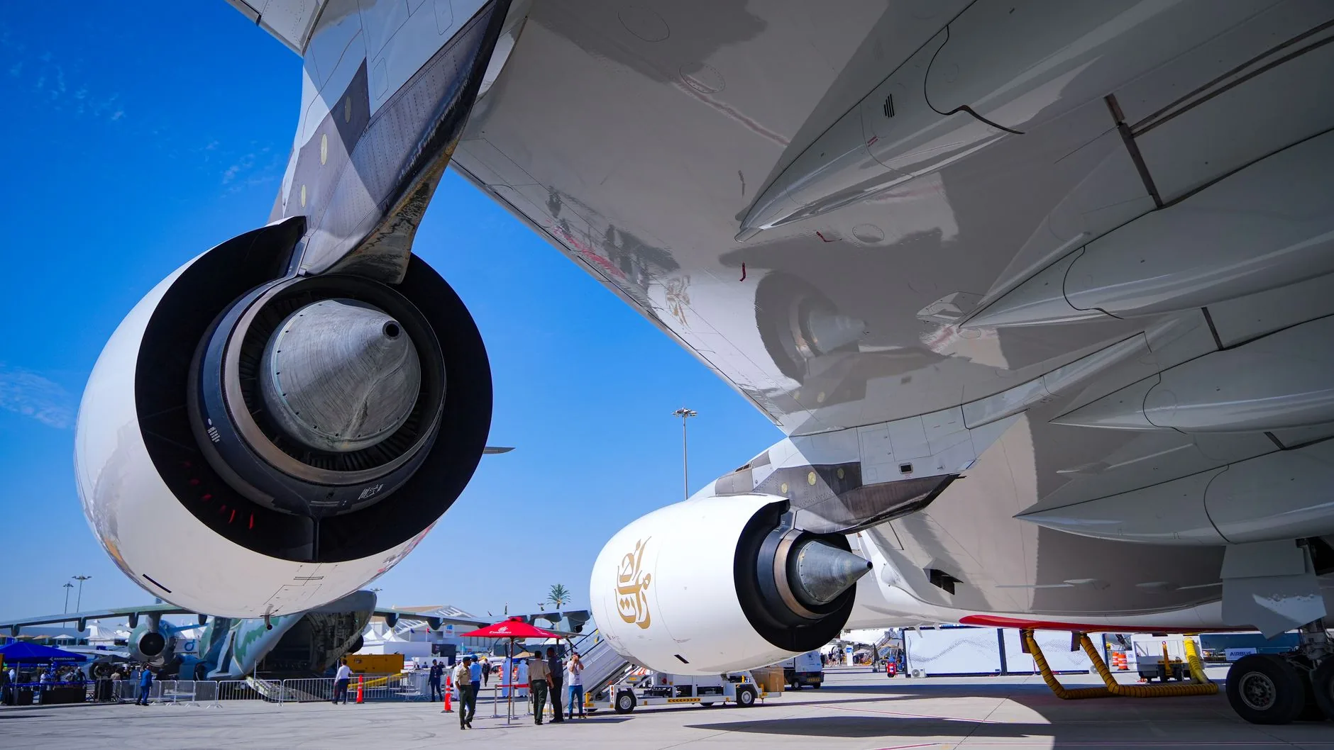 Detailed view of Emirates A380 jet engines parked at Dubai airport.