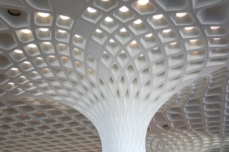 Intricate modern ceiling design at Mumbai Airport showcasing architectural excellence.