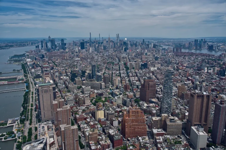 Breathtaking aerial view of the Manhattan skyline with the Hudson River, showcasing New York City's dense architecture.