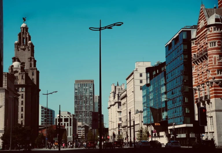 View of Liverpool cityscape showcasing historic and modern architecture on a clear day.