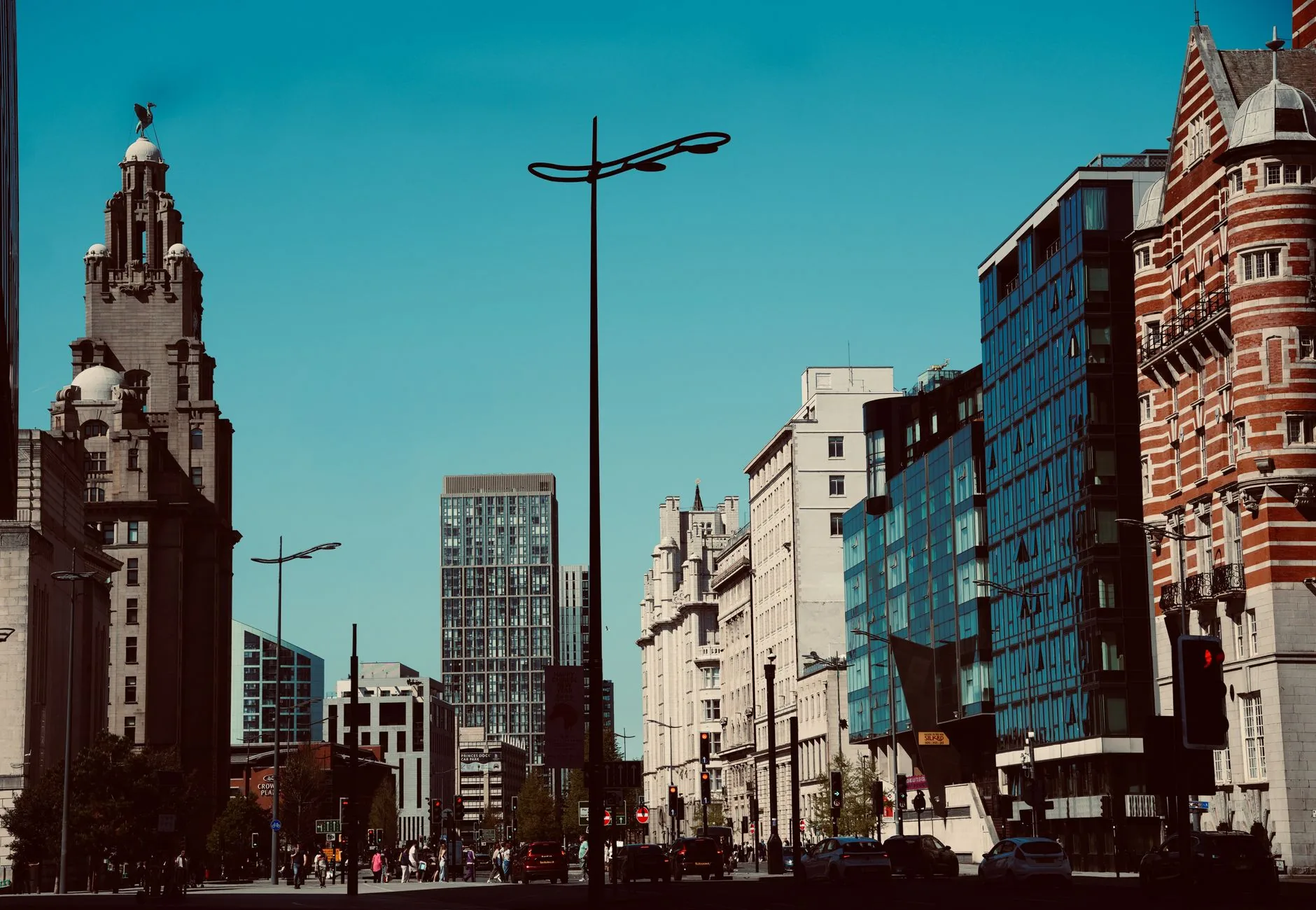 View of Liverpool cityscape showcasing historic and modern architecture on a clear day.