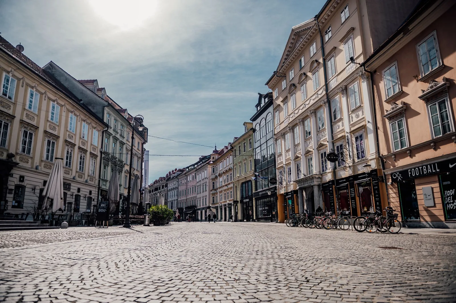 Beautiful historic street in Ljubljana, Slovenia with cobblestone pavement and classic architecture.