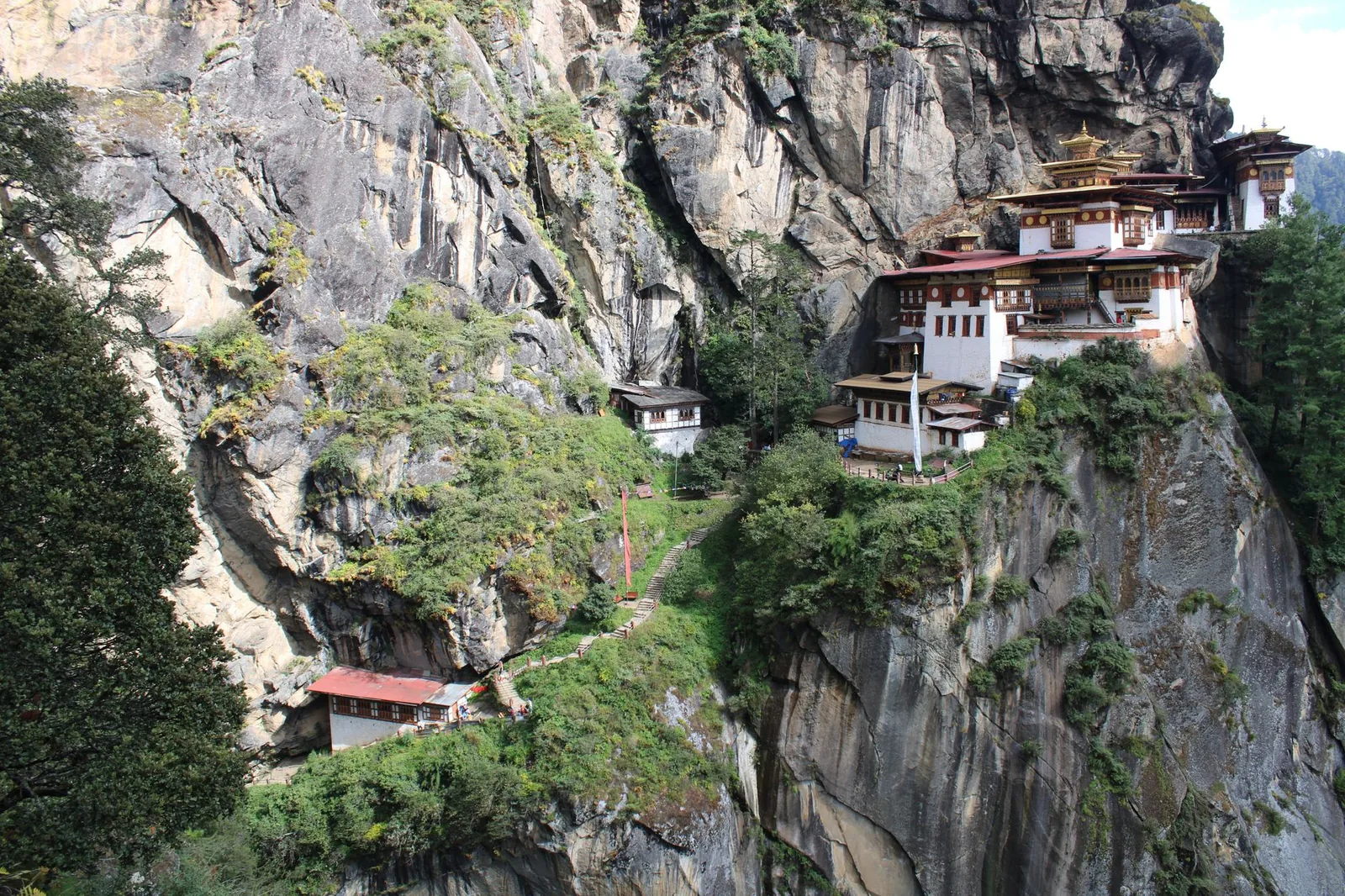 Spectacular view of Tiger's Nest Monastery perched on Bhutan's rocky cliffs, showcasing its architectural magnificence.