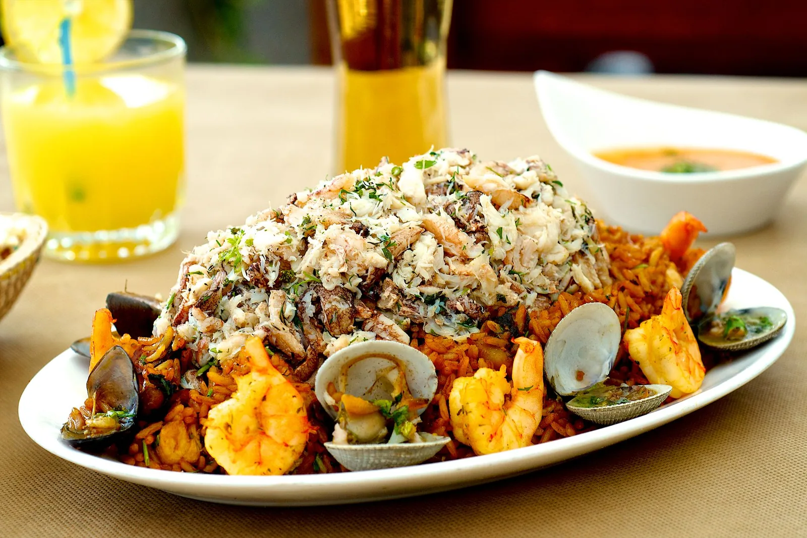 A close-up of seafood paella with shrimp, clams, and crab meat, perfect for a gourmet meal.