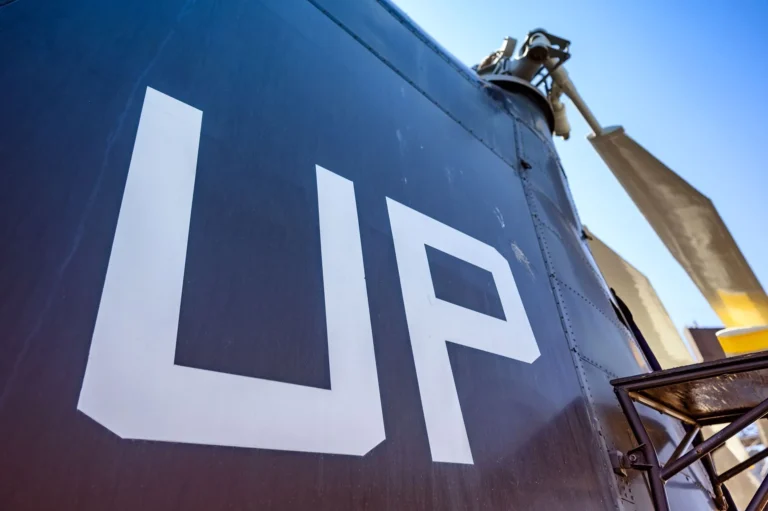 Close-up view of an aircraft exterior with 'UP' sign photographed at an aviation museum in San Diego.