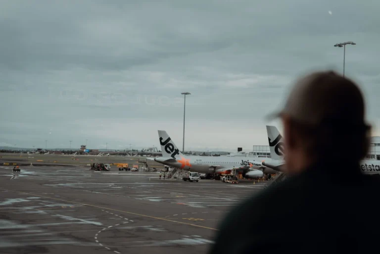 Airplanes at a Sydney airport terminal, illustrating air travel and future airport connections.