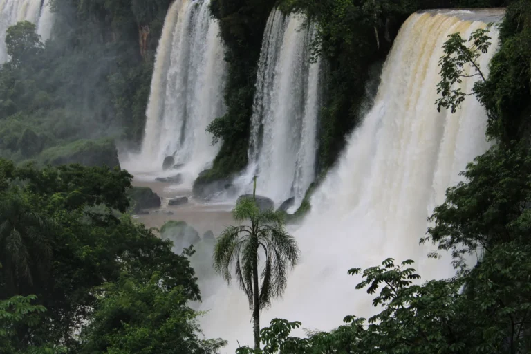 Stunning view of lush Iguazu Falls cascading through the jungle in Misiones, Argentina.