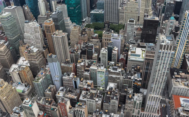 Dynamic aerial view of Manhattan's iconic skyscrapers showcasing New York City's urban landscape.