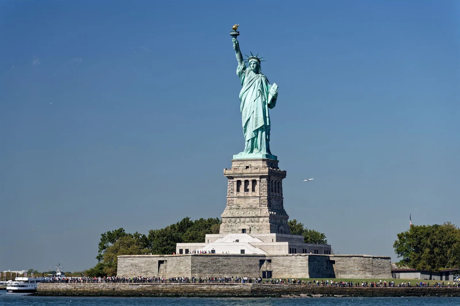 View of the Statue of Liberty with clear blue skies on Liberty Island, New York.