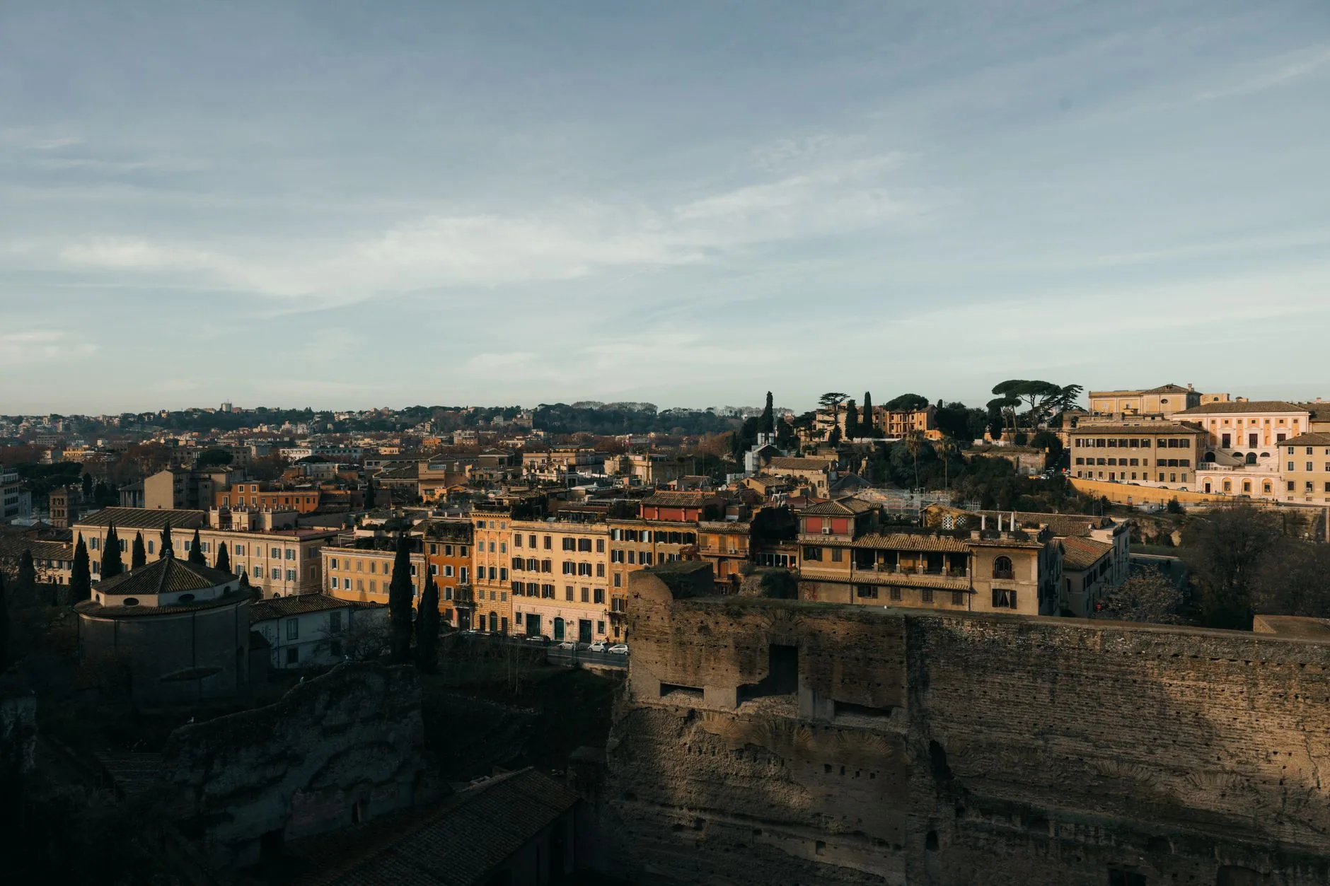 A stunning cityscape of Rome, Italy, captured at sunset, highlighting historic architecture.
