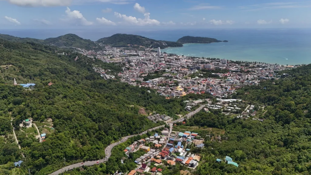 Stunning aerial view of Patong Beach and cityscape on a sunny day in Phuket, Thailand.