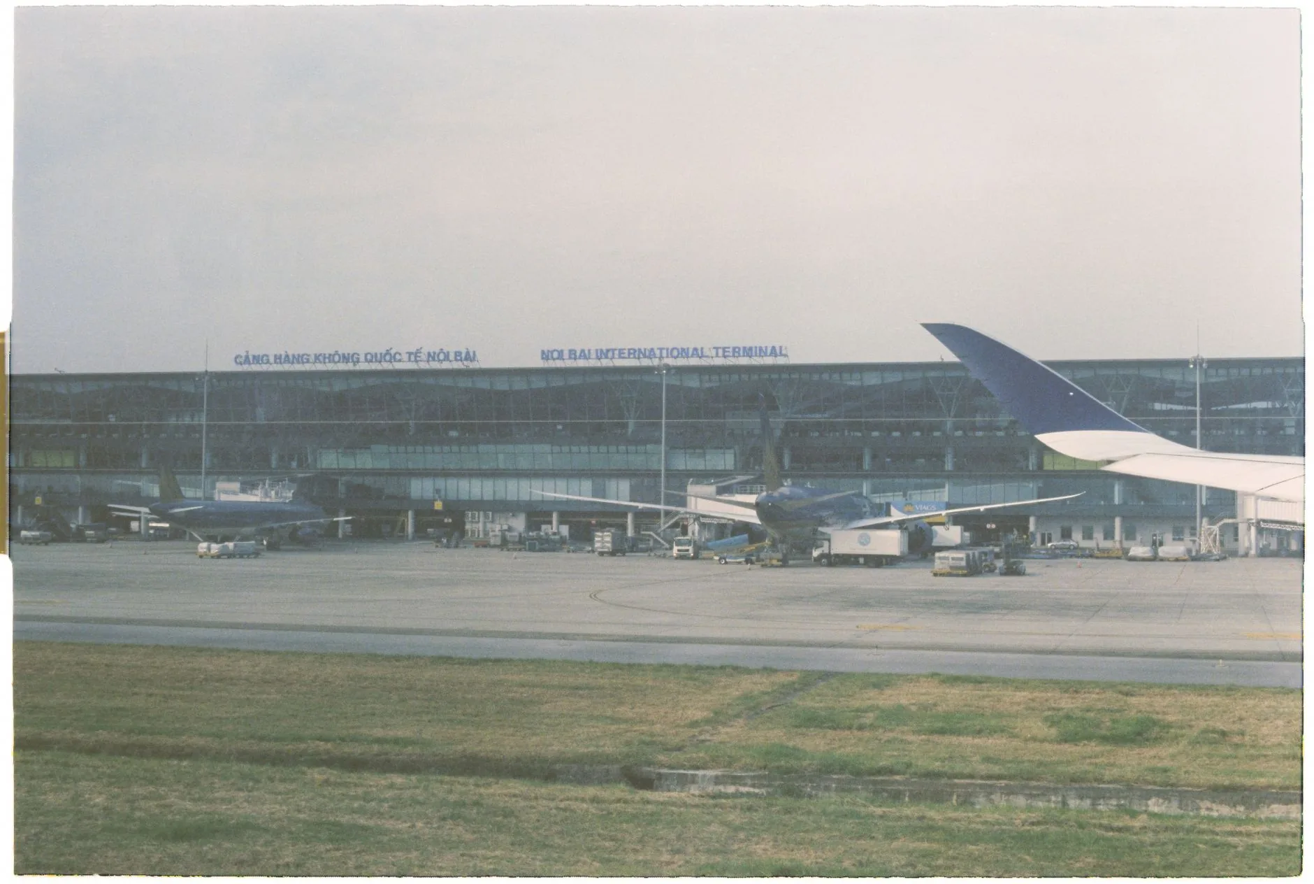 Airplanes on the tarmac at Noi Bai International Airport in Hanoi, Vietnam.